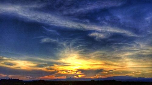 Low angle view of dramatic sky during sunset