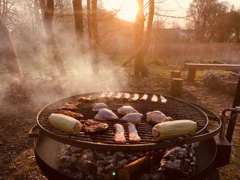 Panoramic shot of meat on barbecue grill