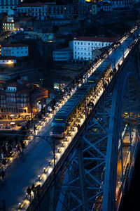 High angle view of illuminated buildings in city at night