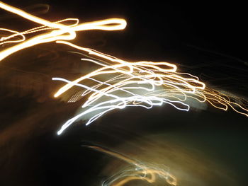 Low angle view of firework display at night