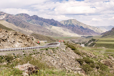 Scenic view of landscape and mountains against sky