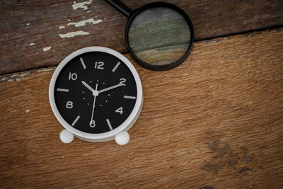 High angle view of clock on table