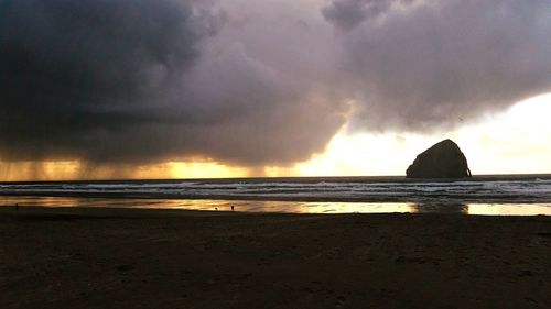 Scenic view of sea against sky at sunset