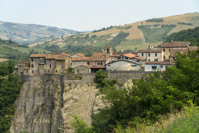 High angle view of buildings and mountains against sky