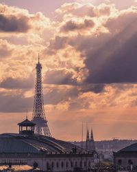 Low angle view of monument against cloudy sky