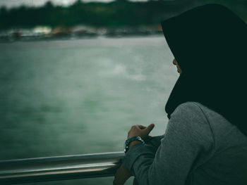 Rear view of man looking at sea