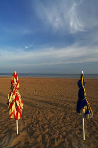 Boy on beach against sky