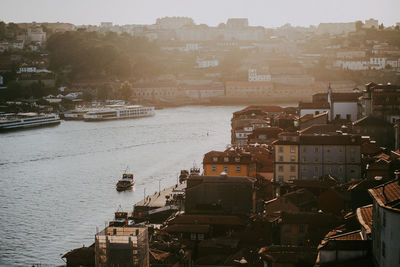 High angle view of river by buildings in city