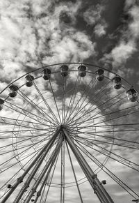 Low angle view of ferris wheel against sky