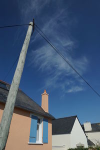 Low angle view of buildings against blue sky