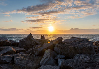 Scenic view of sea at sunset