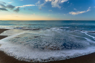 Scenic view of sea against sky during sunrise