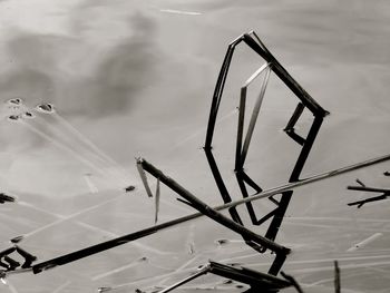 Close-up of metal structure against sky