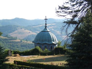 Traditional building by mountains against clear sky sokolski monastery holy mother's assumption 