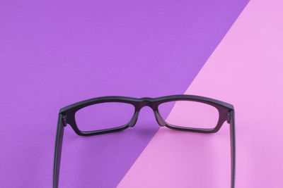 High angle view of eyeglasses on paper