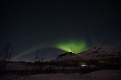 Scenic view of landscape against sky at night