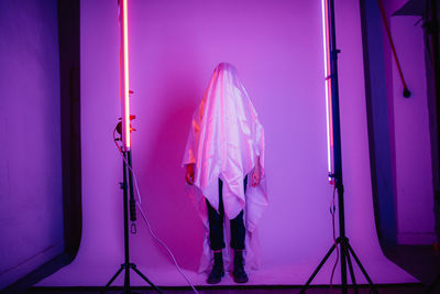 Woman with fabric on body in studio