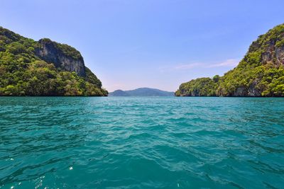 Scenic view of sea against clear blue sky