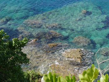 High angle view of rocks by sea