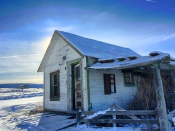 Houses on snow covered landscape