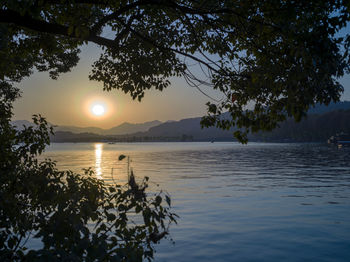 Scenic view of lake against sky during sunset