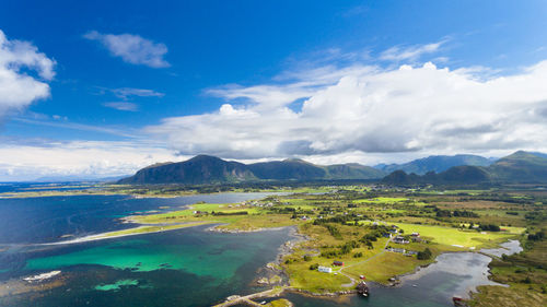 Scenic view of landscape and sea against sky