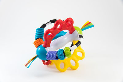 Close-up of colorful toy over white background