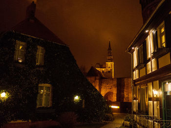 Illuminated buildings in city at night