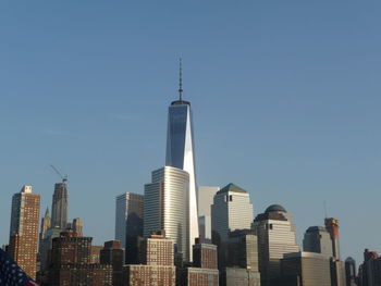 Skyscrapers in city against clear sky