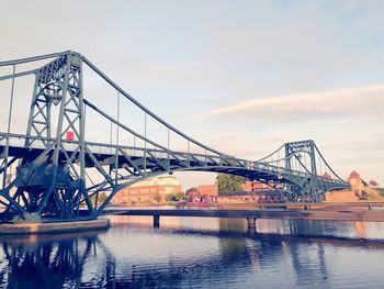 Bridge over river against sky