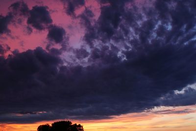 Low angle view of dramatic sky at sunset