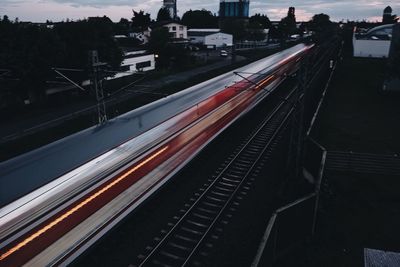 High angle view of light trails on railway tracks at night