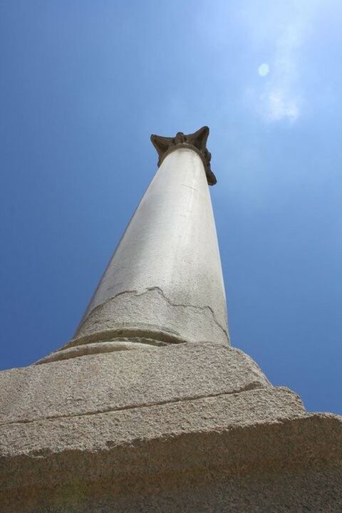 LOW ANGLE VIEW OF BLUE COLUMN AGAINST SKY