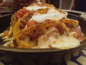 Close-up of pizza served on table