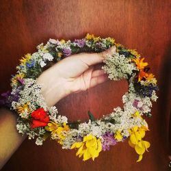 Close-up of hand holding flower