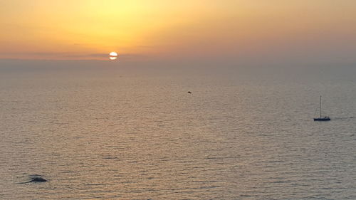 Scenic view of sea at sunset