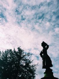 Low angle view of statue against sky