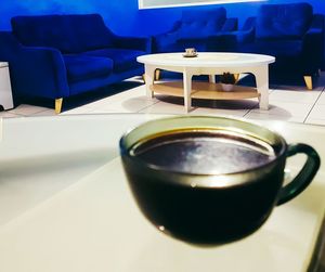 Close-up of empty coffee cup on table