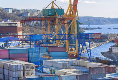 Set of containers and cranes in seaport on kamchatka in november