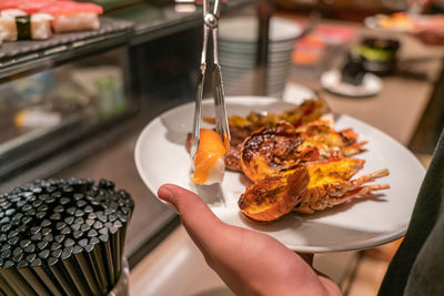 Close-up of hand holding food