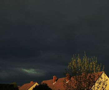 Low angle view of building against cloudy sky