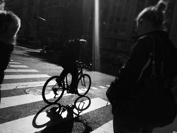 People on bicycle in city