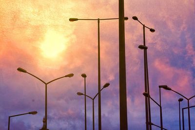 Low angle view of street light against sky during sunset