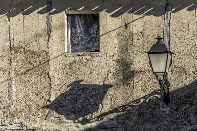 Low angle view of window on wall