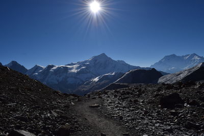 Scenic view of snowcapped mountains against sky