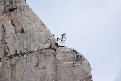 Low angle view of rock formation against clear sky