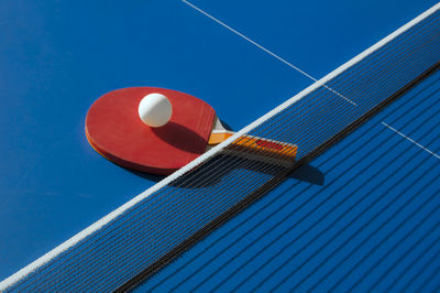 Low angle view of basketball hoop against blue sky