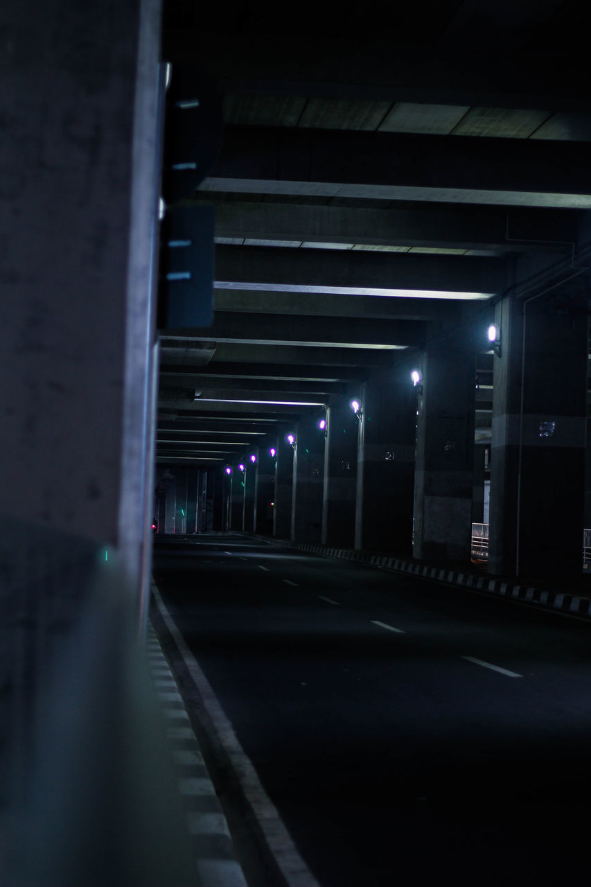 SURFACE LEVEL OF ILLUMINATED ROAD AT NIGHT