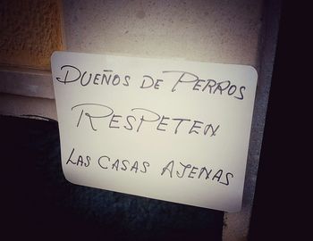 Close-up of text on wall