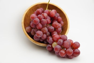 High angle view of grapes in bowl on table